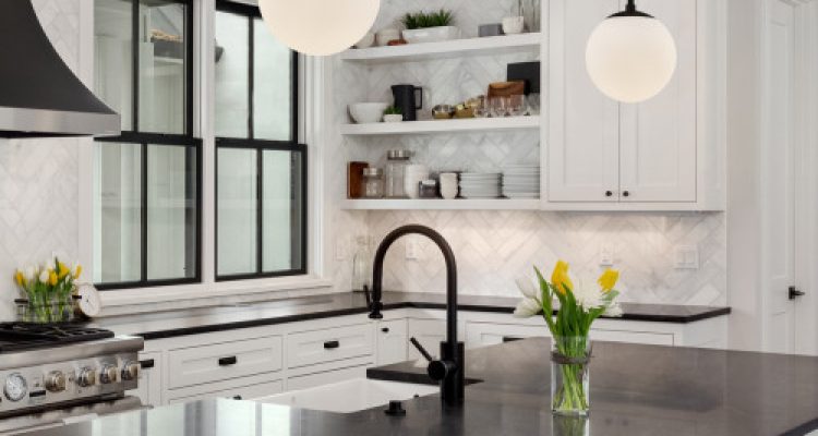 Modern White Kitchen With Black Countertops